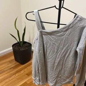 Half Shoulder off gray sweater.